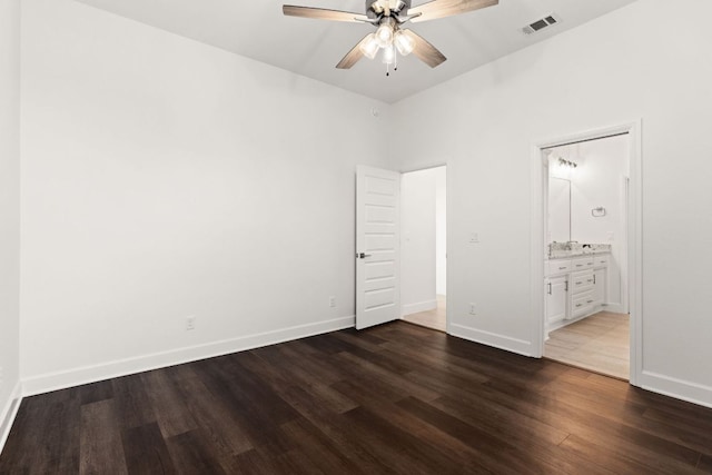 112 Vista De Luna Ln, Belton, TX 76513 - unfurnished bedroom with dark wood-style floors, connected bathroom, and a ceiling fan