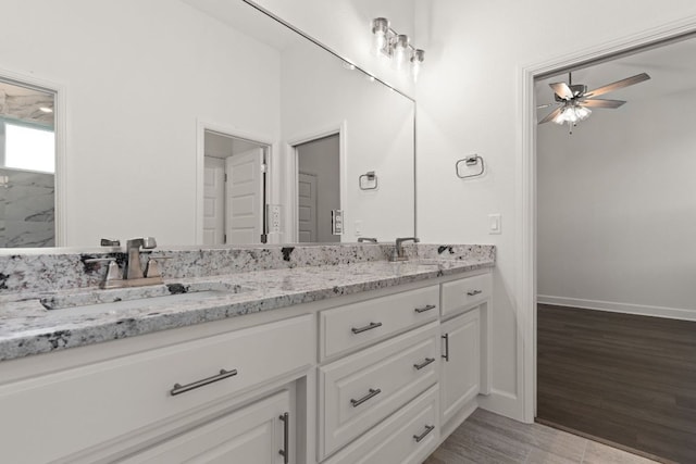 112 Vista De Luna Ln, Belton, TX 76513 - bathroom featuring double vanity, ceiling fan, and wood finished floors