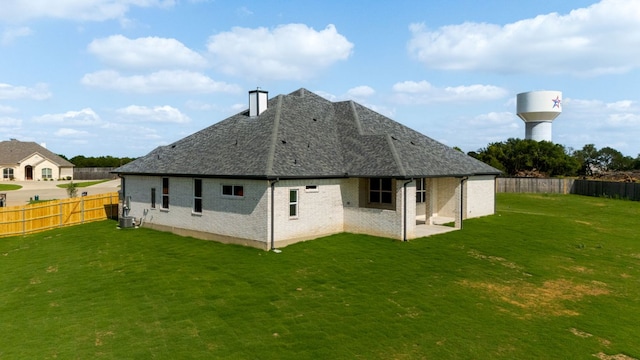 112 Vista De Luna Ln, Belton, TX 76513 - rear view of property featuring a fenced backyard, a chimney, a patio area, and brick siding