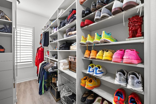 1013 Highknoll Ln, Georgetown, TX 78628 - walk in closet with wood finished floors