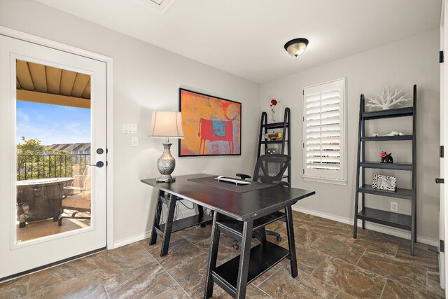 1013 Highknoll Ln, Georgetown, TX 78628 - home office featuring stone tile floors and baseboards