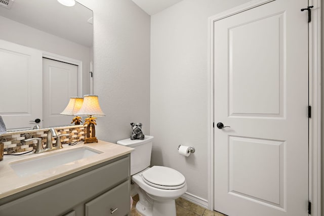1013 Highknoll Ln, Georgetown, TX 78628 - half bathroom with vanity, decorative backsplash, and tile patterned floors