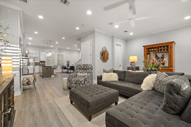 1013 Highknoll Ln, Georgetown, TX 78628 - living area featuring light wood-style floors, ceiling fan, ornamental molding, and recessed lighting