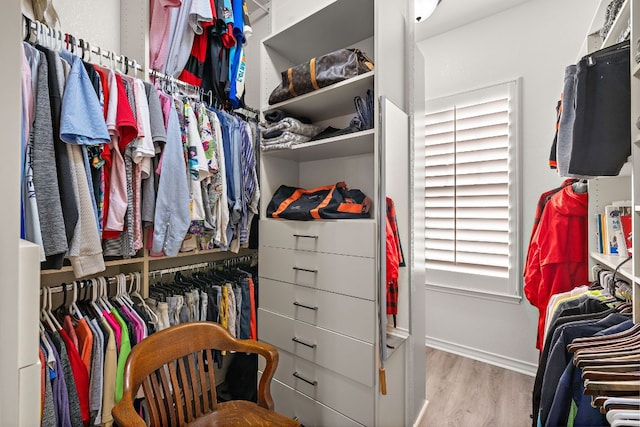 1013 Highknoll Ln, Georgetown, TX 78628 - walk in closet with wood finished floors