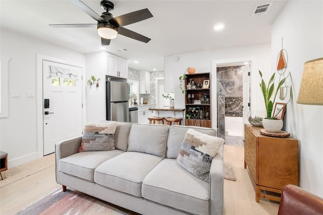 1616 Webberville Rd Unit A, Austin, TX 78721 - living room with ceiling fan, recessed lighting, and light wood-style flooring