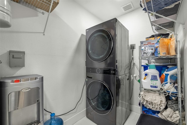 1616 Webberville Rd Unit A, Austin, TX 78721 - laundry room featuring estacked washer and dryer