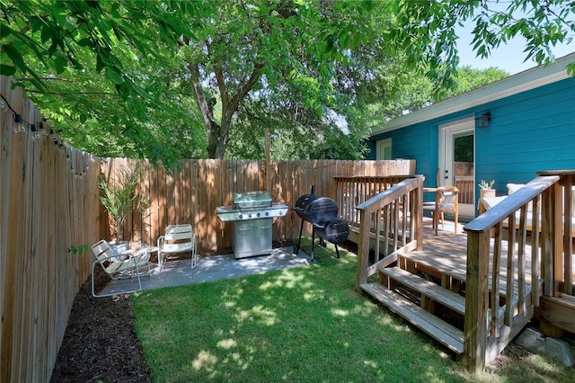 1616 Webberville Rd Unit A, Austin, TX 78721 - fenced backyard with a wooden deck and a patio