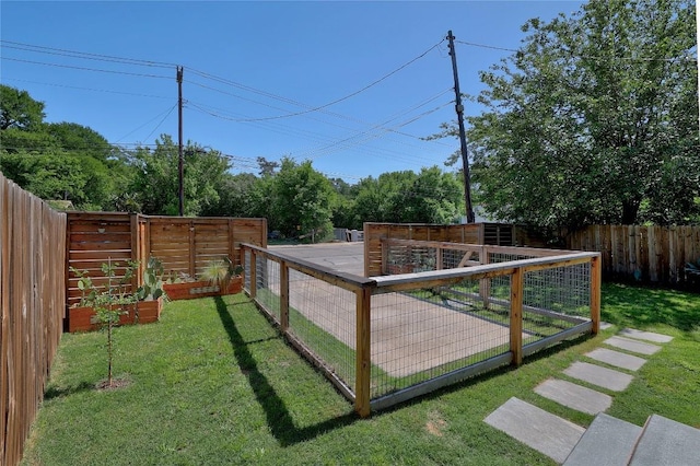 1616 Webberville Rd Unit A, Austin, TX 78721 - fenced backyard featuring a vegetable garden