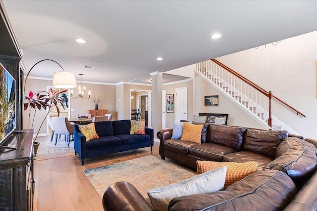8007 Davis Mountain Cv, Austin, TX 78726 - living room with ornamental molding, light wood finished floors, a chandelier, stairway, and recessed lighting