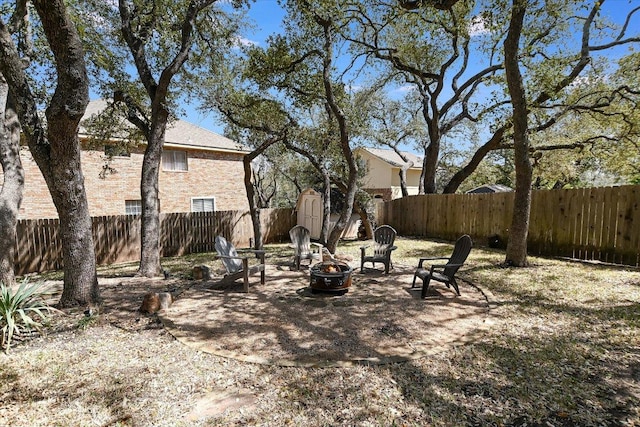 8007 Davis Mountain Cv, Austin, TX 78726 - fenced backyard featuring an outdoor fire pit