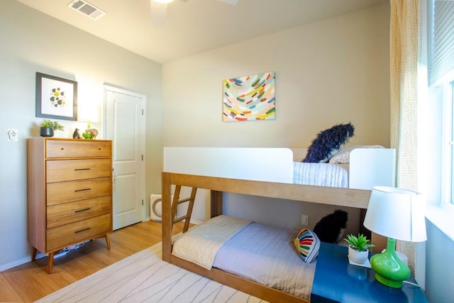 188 Catalina Dr, Kyle, TX 78640 - bedroom featuring ceiling fan, wood finished floors, and visible vents
