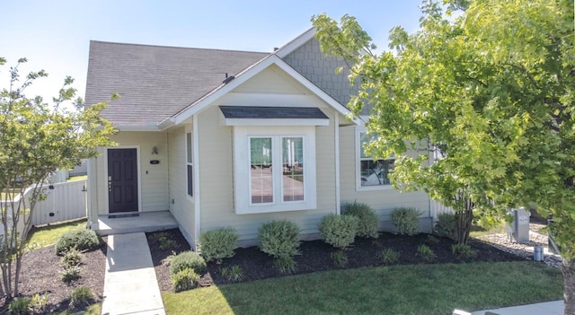 188 Catalina Dr, Kyle, TX 78640 - view of front of home featuring fence, a shingled roof, and a front yard