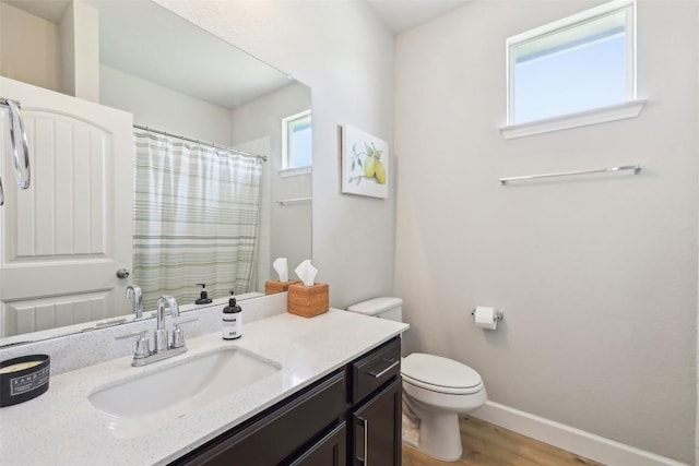 353 Cherry Laurel Ln, Kyle, TX 78640 - full bath with toilet, wood finished floors, baseboards, vanity, and a shower with shower curtain
