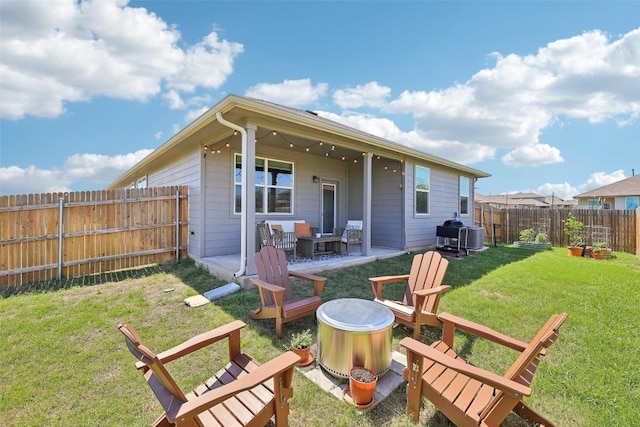 353 Cherry Laurel Ln, Kyle, TX 78640 - back of property featuring an outdoor fire pit, a patio area, and central air condition unit