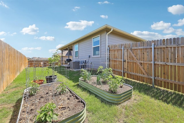 353 Cherry Laurel Ln, Kyle, TX 78640 - view of yard featuring a vegetable garden and cooling unit