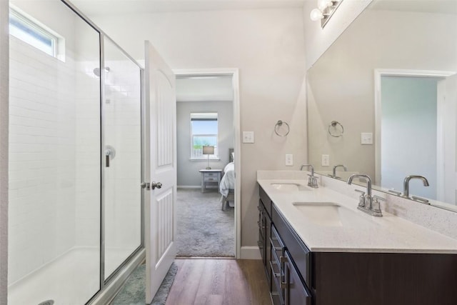 353 Cherry Laurel Ln, Kyle, TX 78640 - bathroom featuring plenty of natural light, wood finished floors, connected bathroom, and a shower stall