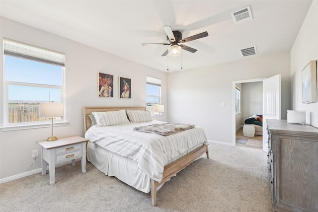 353 Cherry Laurel Ln, Kyle, TX 78640 - bedroom featuring light colored carpet, baseboards, and a ceiling fan