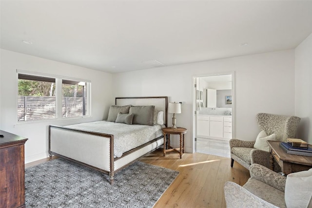 7 Rocky River Cv, West Lake Hills, TX 78746 - bedroom featuring light wood finished floors and connected bathroom