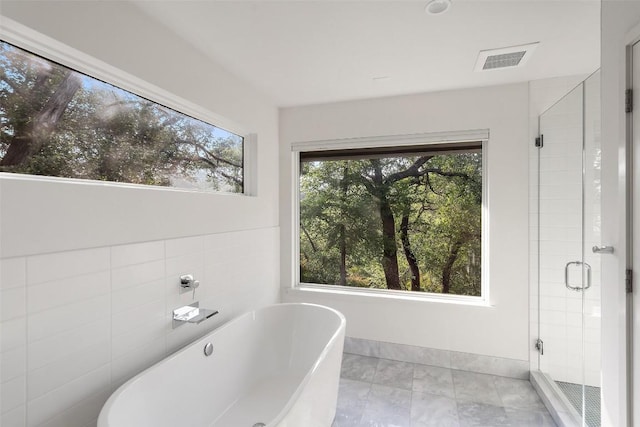 7 Rocky River Cv, West Lake Hills, TX 78746 - bathroom with a freestanding tub, visible vents, and a stall shower
