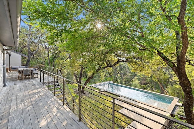 7 Rocky River Cv, West Lake Hills, TX 78746 - wooden deck with outdoor dining area