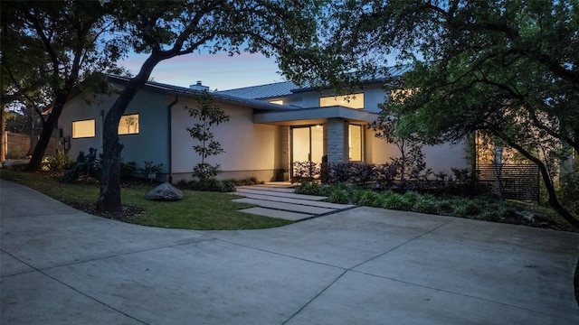 7 Rocky River Cv, West Lake Hills, TX 78746 - view of front facade with stucco siding