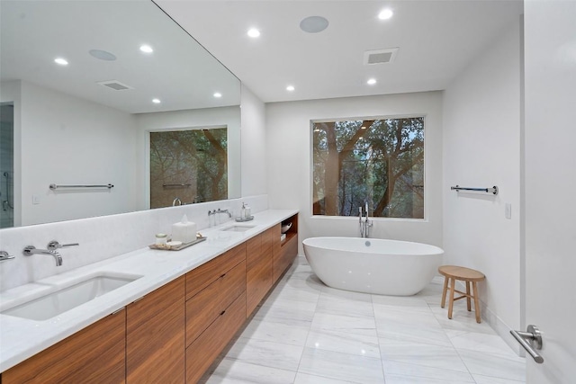 7 Rocky River Cv, West Lake Hills, TX 78746 - bathroom featuring recessed lighting, visible vents, and a sink