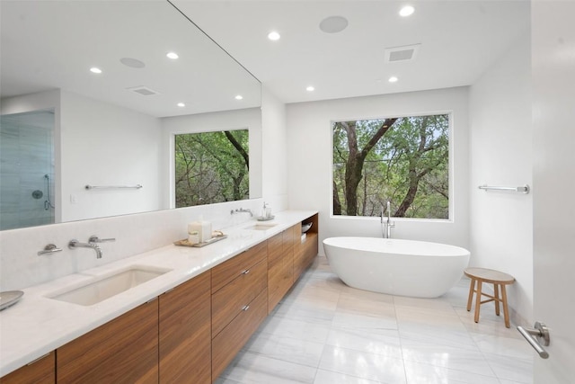 7 Rocky River Cv, West Lake Hills, TX 78746 - bathroom with a sink, visible vents, recessed lighting, and a freestanding tub