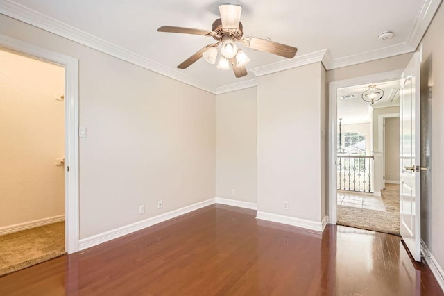 8404 Cahill Dr, Austin, TX 78729 - spare room with wood finished floors, ceiling fan, crown molding, and a smoke detector