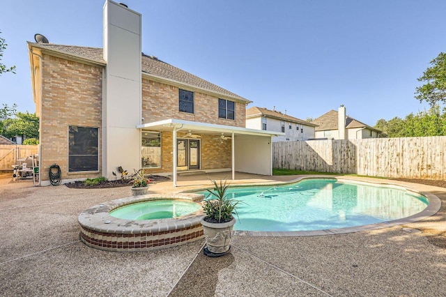 8404 Cahill Dr, Austin, TX 78729 - view of swimming pool featuring a patio area, an in-ground hot tub, a fenced backyard, and ceiling fan