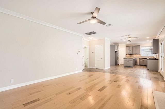 8404 Cahill Dr, Austin, TX 78729 - unfurnished living room with a ceiling fan, ornamental molding, light wood finished floors, and baseboards
