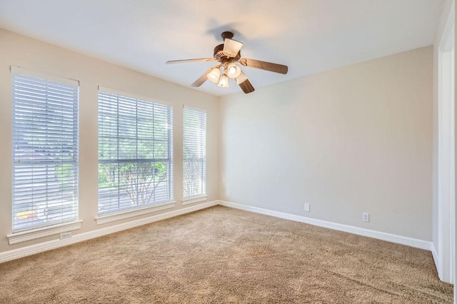 8404 Cahill Dr, Austin, TX 78729 - empty room with carpet floors, healthy amount of natural light, and a ceiling fan