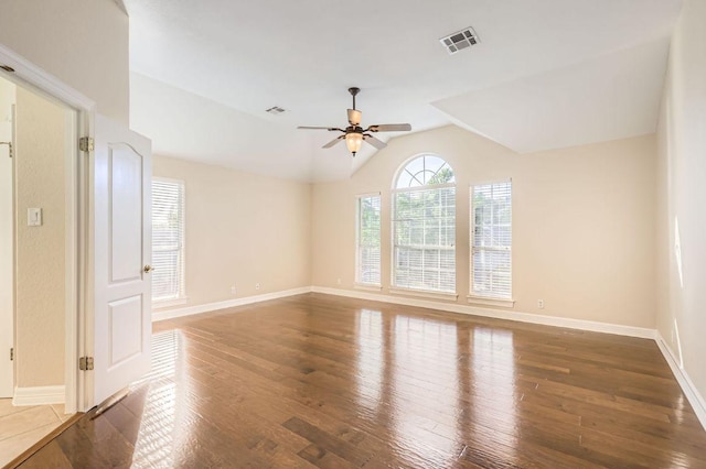 8404 Cahill Dr, Austin, TX 78729 - spare room featuring ceiling fan, hardwood / wood-style flooring, vaulted ceiling, and baseboards