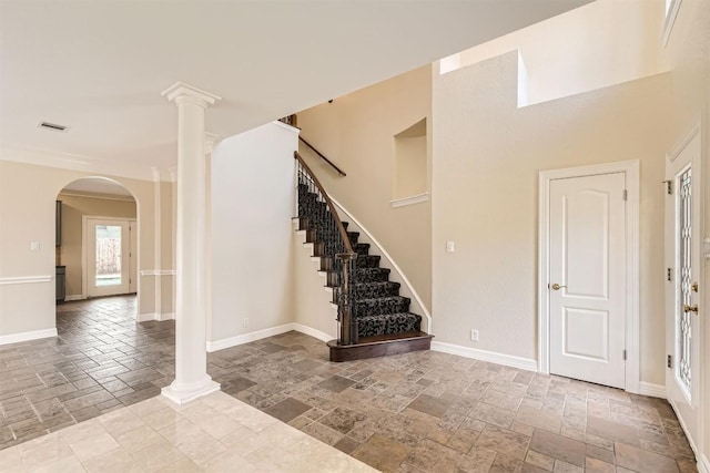 8404 Cahill Dr, Austin, TX 78729 - entrance foyer with stone tile floors, baseboards, and stairway