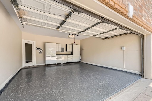 8404 Cahill Dr, Austin, TX 78729 - garage with a garage door opener and baseboards