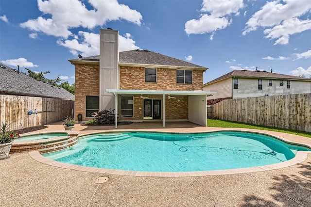 8404 Cahill Dr, Austin, TX 78729 - view of swimming pool featuring a patio, a fenced backyard, and a pool with connected hot tub