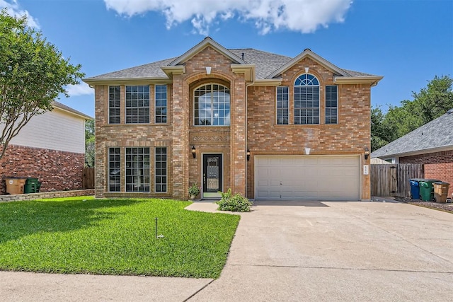 8404 Cahill Dr, Austin, TX 78729 - traditional-style home with concrete driveway, brick siding, a garage, and a shingled roof