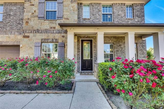 4829 Pyrenees Pass, Austin, TX 78738 - doorway to property featuring stone siding and covered porch