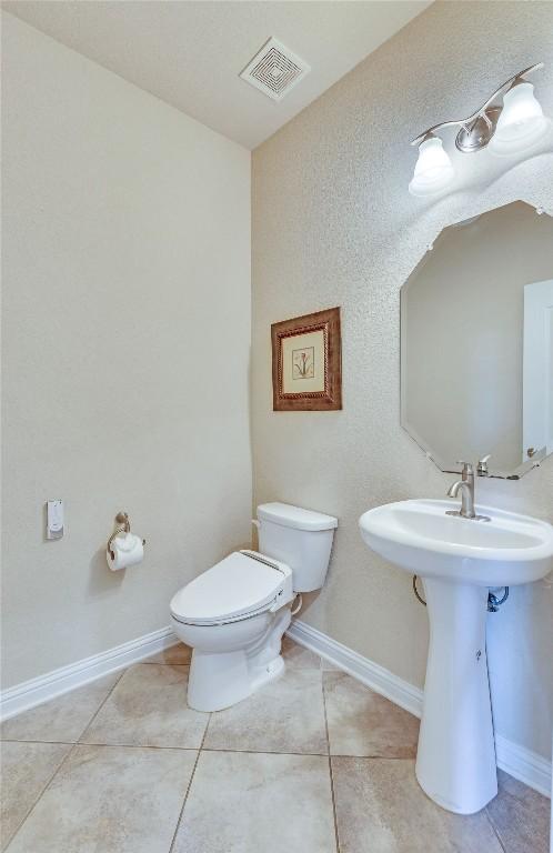 4829 Pyrenees Pass, Austin, TX 78738 - bathroom featuring toilet and tile patterned floors