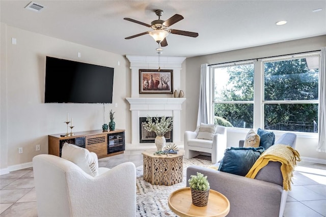 4829 Pyrenees Pass, Austin, TX 78738 - living area featuring light tile patterned floors, ceiling fan, a fireplace, and recessed lighting