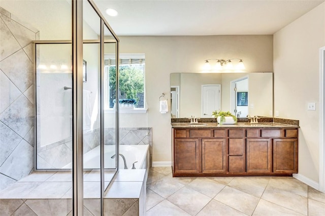 4829 Pyrenees Pass, Austin, TX 78738 - bathroom featuring double vanity, a garden tub, an enclosed shower, and tile patterned floors