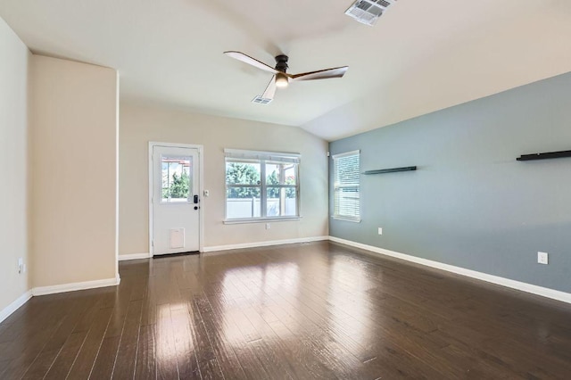 unfurnished living room featuring visible vents, baseboards, a ceiling fan, vaulted ceiling, and wood finished floors