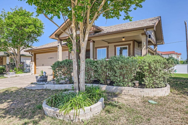 view of front of property featuring driveway and a garage