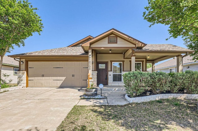 view of front of property featuring an attached garage and driveway