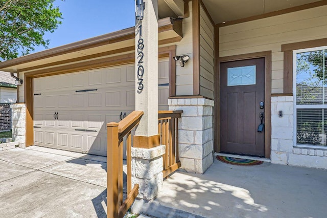 view of exterior entry featuring a garage