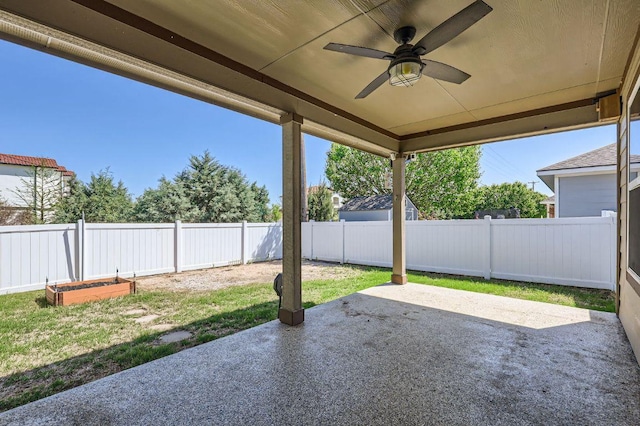 view of patio with a fenced backyard and a ceiling fan