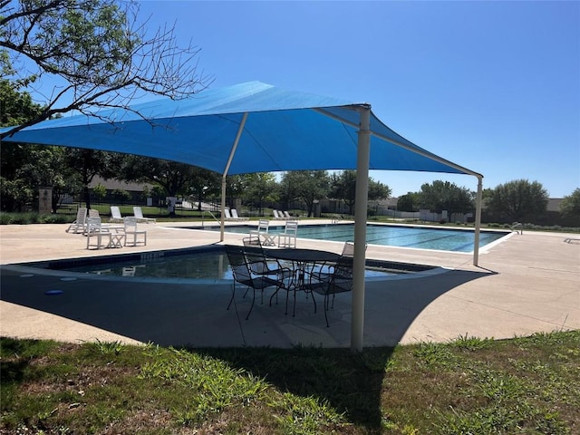 community pool featuring a patio