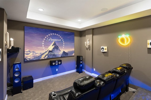 cinema featuring carpet floors, recessed lighting, baseboards, and a tray ceiling