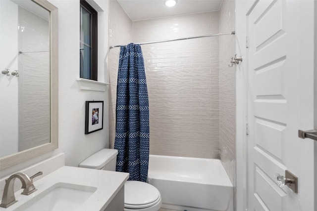 full bath featuring vanity, shower / bathtub combination with curtain, and toilet