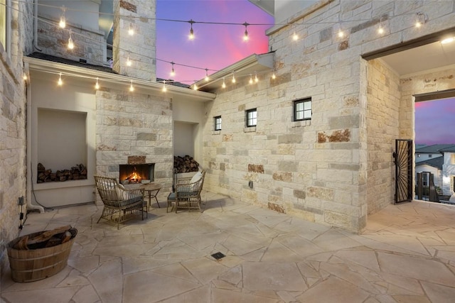 505 Woodside Ter, Austin, TX 78738 - view of patio / terrace with an outdoor stone fireplace