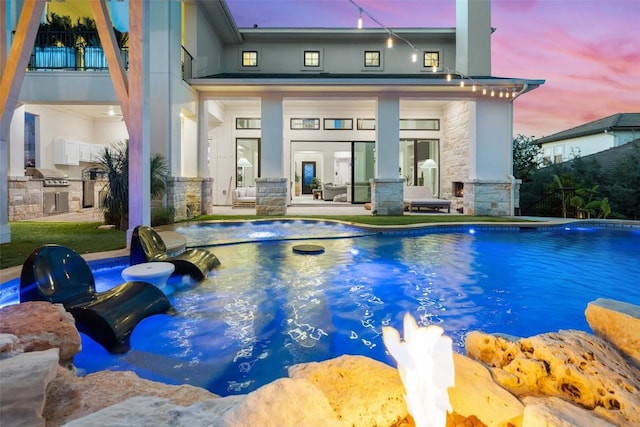 outdoor pool with area for grilling